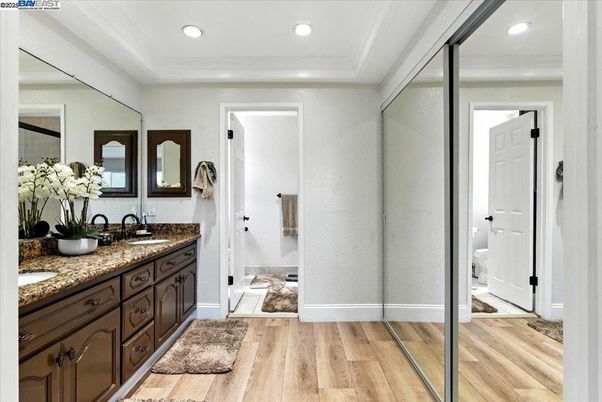Bathroom, Dual Sink Vanities, Interior, Recessed Lighting, Wood Texture Flooring