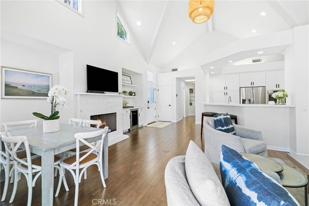 Dining room, Fireplace, Interior, Kitchen, Living room, Recessed Lighting, Stainless Steel Appliances, Wood Texture Flooring