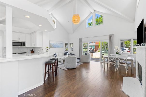 Dining room, Fireplace, Interior, Kitchen, Living room, Pendant Lights, Recessed Lighting, Stainless Steel Appliances, Wood Texture Flooring