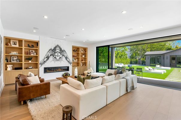 Fireplace, Interior, Living room, Marble Walls, Recessed Lighting, Wood Texture Flooring