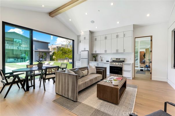 Dining room, Interior, Kitchen, Living room, Recessed Lighting, Stainless Steel Appliances, Wooden Beams, Wood Texture Flooring