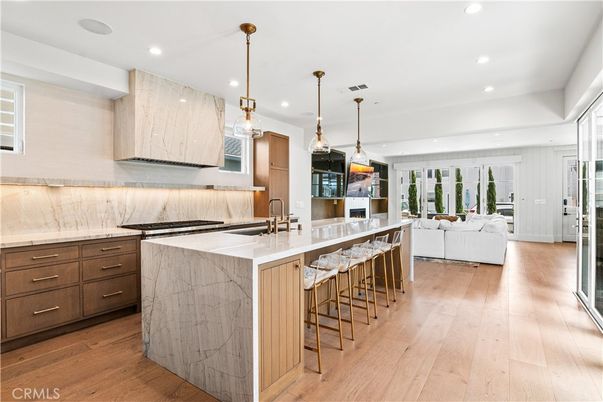 Interior, Kitchen, Living room, Marble Walls, Pendant Lights, Recessed Lighting, Stainless Steel Appliances, Wood Texture Flooring