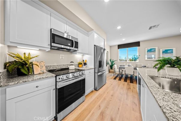 Dining room, Interior, Kitchen, Recessed Lighting, Stainless Steel Appliances, Wood Texture Flooring
