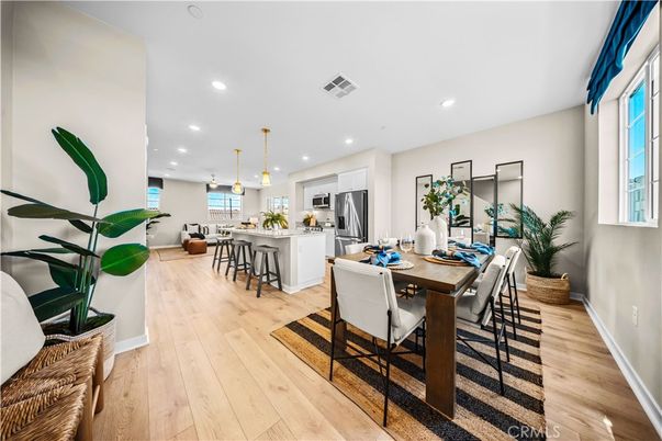 Dining room, Interior, Kitchen, Pendant Lights, Recessed Lighting, Stainless Steel Appliances, Wood Texture Flooring