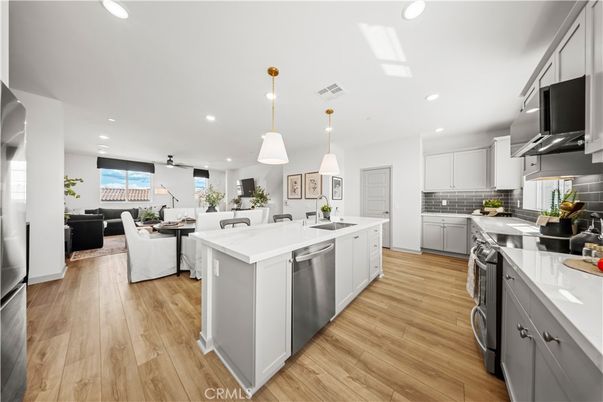 Dining room, Interior, Kitchen, Living room, Pendant Lights, Recessed Lighting, Stainless Steel Appliances, Wood Texture Flooring