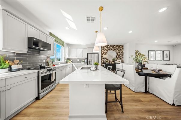 Dining room, Interior, Kitchen, Pendant Lights, Recessed Lighting, Stainless Steel Appliances, Wood Texture Flooring