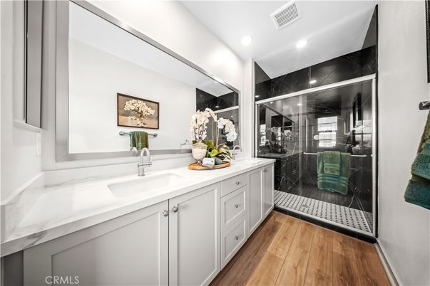 Bathroom, Glass Shower, Interior, Marble Walls, Recessed Lighting, Wood Texture Flooring