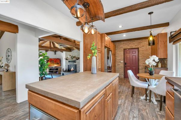 Dining room, Fireplace, Interior, Kitchen, Pendant Lights, Recessed Lighting, Stainless Steel Appliances, Stone Walls, Wooden Beams, Wood Texture Flooring