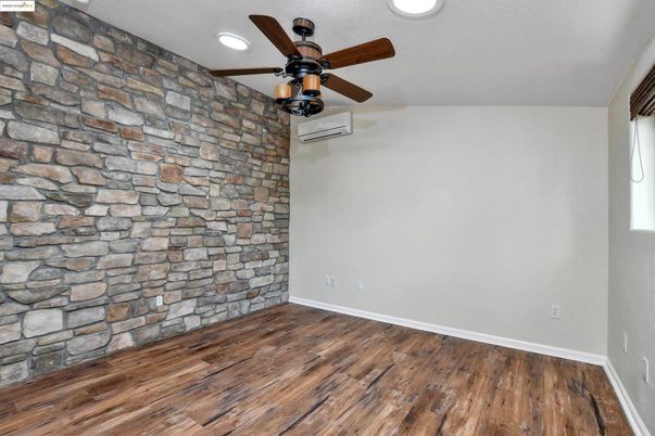 Empty room, Interior, Recessed Lighting, Stone Walls, Wood Texture Flooring