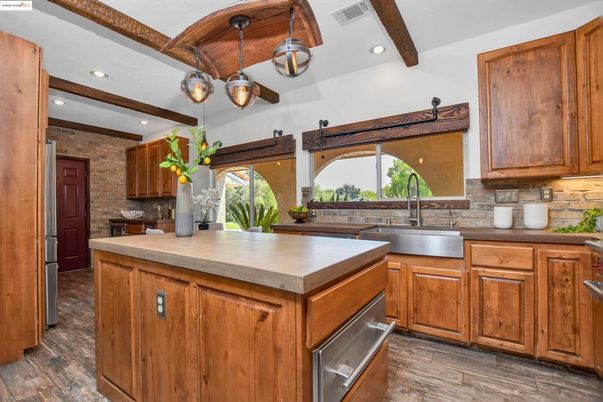 Interior, Kitchen, Pendant Lights, Recessed Lighting, Stainless Steel Appliances, Stone Walls, Wooden Beams, Wood Texture Flooring