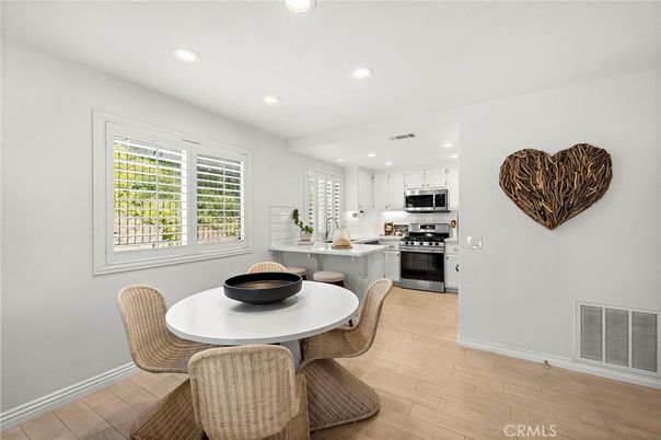 Dining room, Interior, Kitchen, Recessed Lighting, Stainless Steel Appliances, Wood Texture Flooring