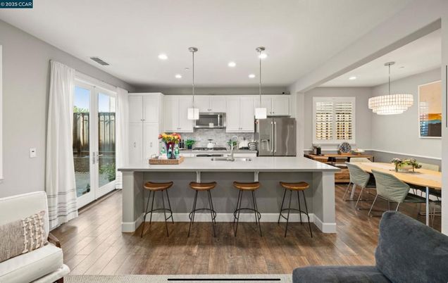 Chandelier, Dining room, Interior, Kitchen, Pendant Lights, Recessed Lighting, Stainless Steel Appliances, Wood Texture Flooring