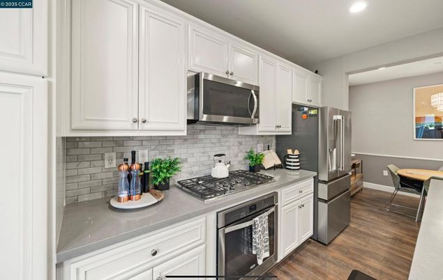 Dining room, Interior, Kitchen, Recessed Lighting, Stainless Steel Appliances, Wood Texture Flooring