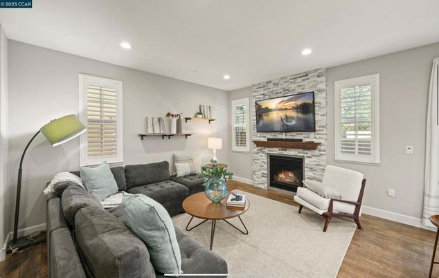 Fireplace, Interior, Living room, Recessed Lighting, Stone Walls, Wood Texture Flooring