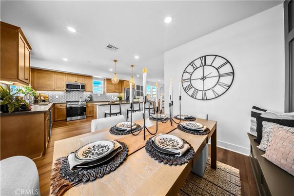 Dining room, Interior, Kitchen, Pendant Lights, Recessed Lighting, Stainless Steel Appliances, Wood Texture Flooring