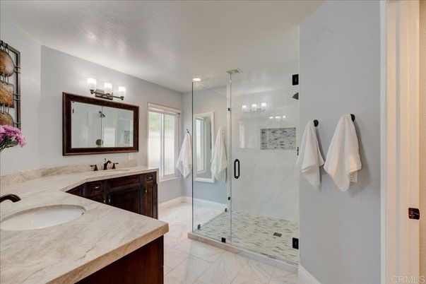 Bathroom, Dual Sink Vanities, Glass Shower, Interior, Marble, Marble Walls, Recessed Lighting