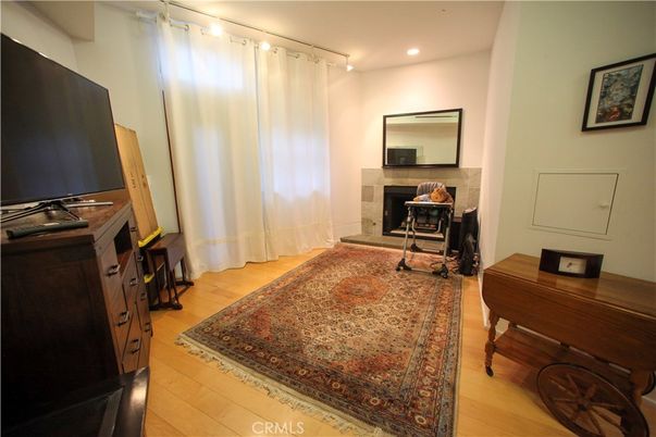 Fireplace, Interior, Piano, Recessed Lighting, Wood Texture Flooring