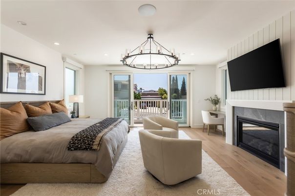 Bedroom, Chandelier, Fireplace, Interior, Recessed Lighting, Wood Texture Flooring