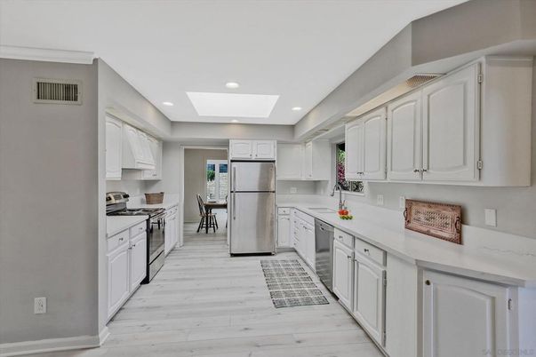 Dining room, Interior, Kitchen, Recessed Lighting, Stainless Steel Appliances, Wood Texture Flooring