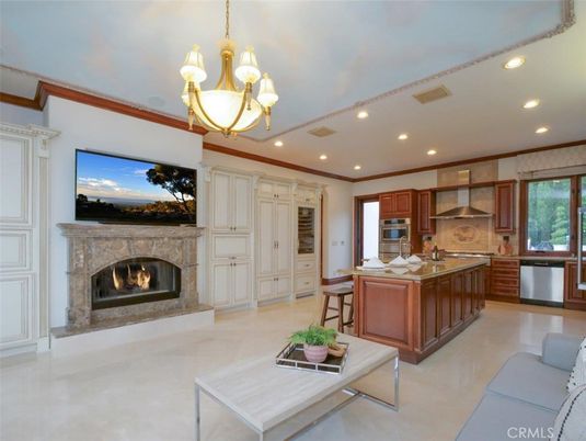 Chandelier, Dining room, Fireplace, Interior, Kitchen, Living room, Recessed Lighting, Stainless Steel Appliances