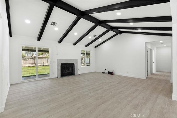 Empty room, Fireplace, Interior, Recessed Lighting, Wooden Beams, Wood Texture Flooring
