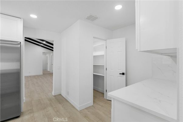 Interior, Kitchen, Marble Walls, Recessed Lighting, Stainless Steel Appliances, Wood Texture Flooring