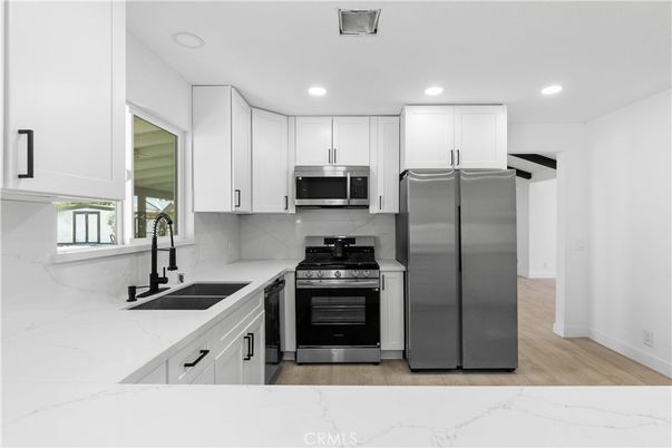 Interior, Kitchen, Recessed Lighting, Stainless Steel Appliances, Wood Texture Flooring