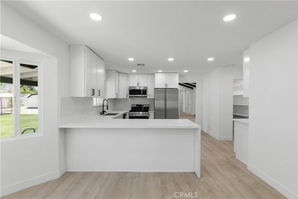 Interior, Kitchen, Recessed Lighting, Stainless Steel Appliances, Wood Texture Flooring