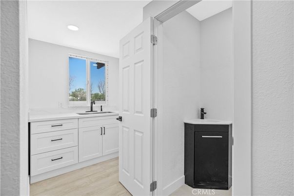 Bathroom, Dual Sink Vanities, Interior, Recessed Lighting, Wood Texture Flooring