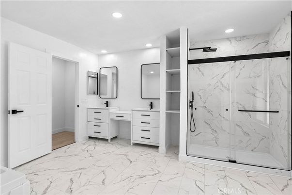 Bathroom, Dual Sink Vanities, Glass Shower, Interior, Marble, Marble Walls, Recessed Lighting