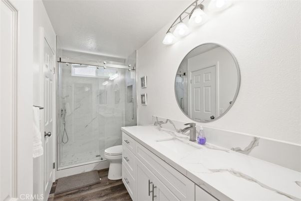 Bathroom, Glass Shower, Interior, Marble Walls, Wood Texture Flooring