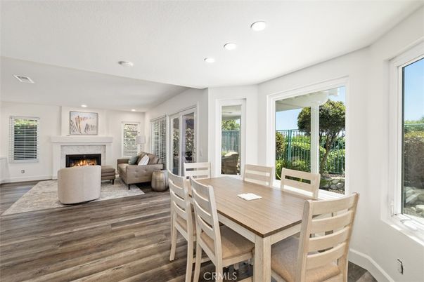 Dining room, Fireplace, Interior, Living room, Recessed Lighting, Wood Texture Flooring