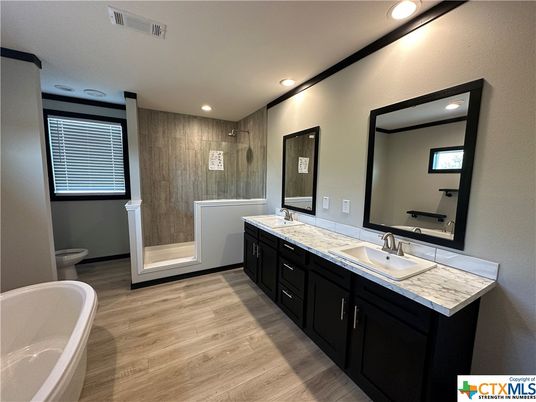 Bathroom, Dual Sink Vanities, Free Standing Baths, Interior, Recessed Lighting, Wood Texture Flooring
