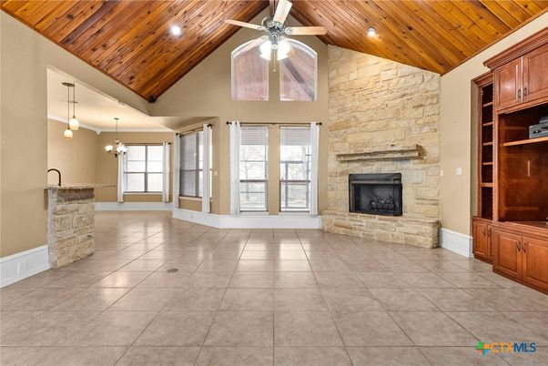 Empty room, Fireplace, Interior, Pendant Lights, Recessed Lighting, Stone Walls, Wooden Ceilings