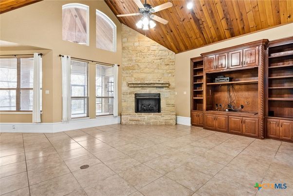Empty room, Fireplace, Interior, Recessed Lighting, Stone Walls, Wooden Ceilings
