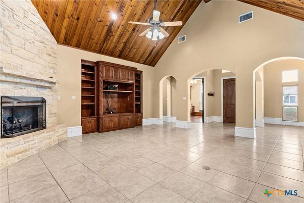 Empty room, Fireplace, Interior, Recessed Lighting, Stone Walls, Wooden Ceilings