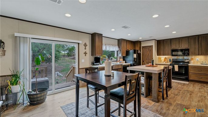 Dining room, Interior, Kitchen, Recessed Lighting, Stainless Steel Appliances, Wood Texture Flooring