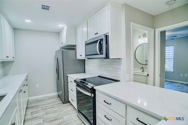 Interior, Kitchen, Recessed Lighting, Stainless Steel Appliances, Wood Texture Flooring