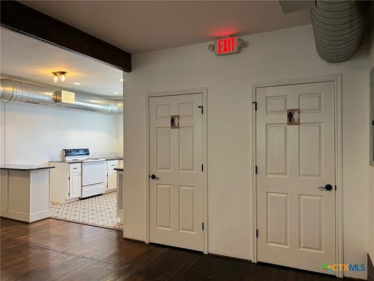 Interior, Kitchen, Recessed Lighting, Washer, Wood Texture Flooring