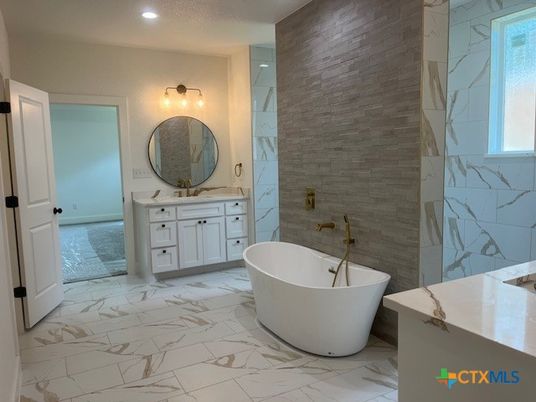 Bathroom, Dual Sink Vanities, Free Standing Baths, Interior, Marble, Marble Walls, Recessed Lighting