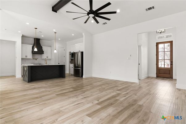 Empty room, Interior, Kitchen, Pendant Lights, Recessed Lighting, Stainless Steel Appliances, Wooden Beams, Wood Texture Flooring