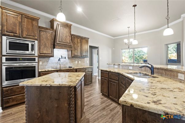 Chandelier, Interior, Kitchen, Pendant Lights, Recessed Lighting, Stainless Steel Appliances, Wood Texture Flooring