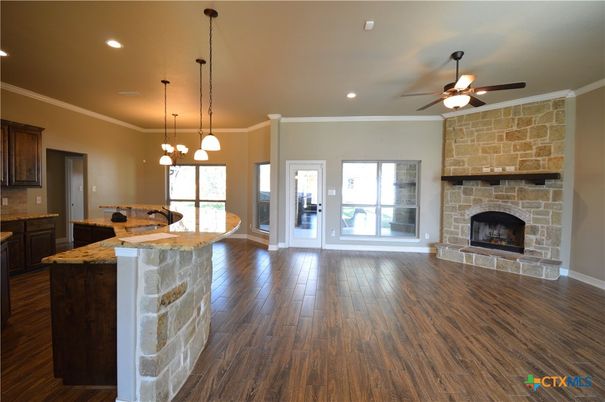 Fireplace, Interior, Kitchen, Pendant Lights, Recessed Lighting, Stone Walls, Wood Texture Flooring