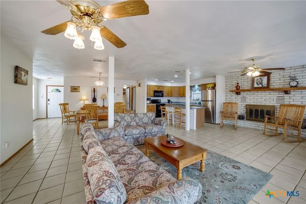 Dining room, Fireplace, Interior, Kitchen, Living room, Recessed Lighting, Stainless Steel Appliances, Stone Walls
