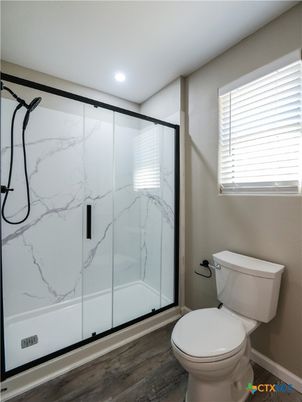 Bathroom, Glass Shower, Interior, Marble Walls, Recessed Lighting, Wood Texture Flooring
