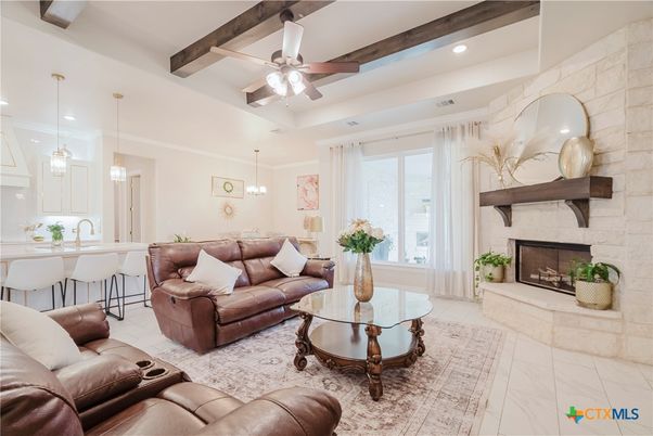 Fireplace, Interior, Living room, Marble, Pendant Lights, Recessed Lighting, Stone Walls, Wooden Beams