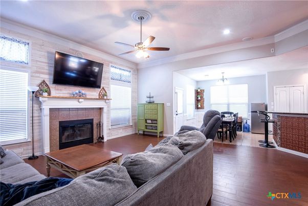 Dining room, Fireplace, Interior, Living room, Pendant Lights, Recessed Lighting, Wood Texture Flooring