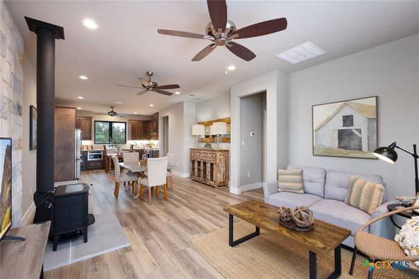 Dining room, Fireplace, Interior, Kitchen, Living room, Recessed Lighting, Stone Walls, Wood Texture Flooring