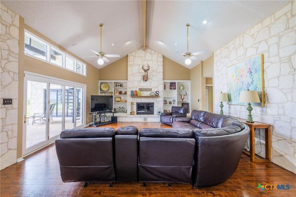 Fireplace, Interior, Living room, Recessed Lighting, Stone Walls, Wood Texture Flooring