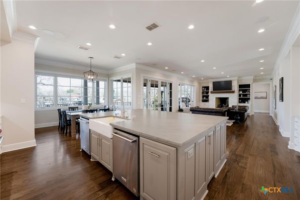 Dining room, Fireplace, Interior, Kitchen, Living room, Pendant Lights, Recessed Lighting, Stainless Steel Appliances, Wood Texture Flooring
